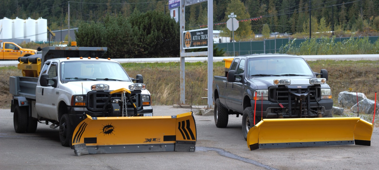 Two plow trucks outside Salmon Arm Auto & Truck